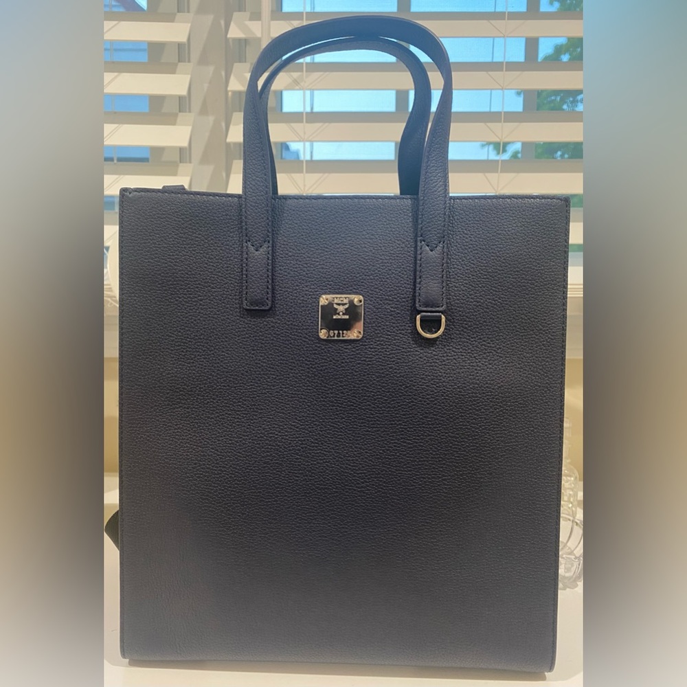 MCM Navy/Black leather crossbody tote bag with floral print sides .